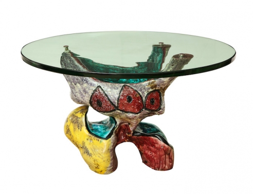 Ceramic sculptural low table with round glass top and brass fittings